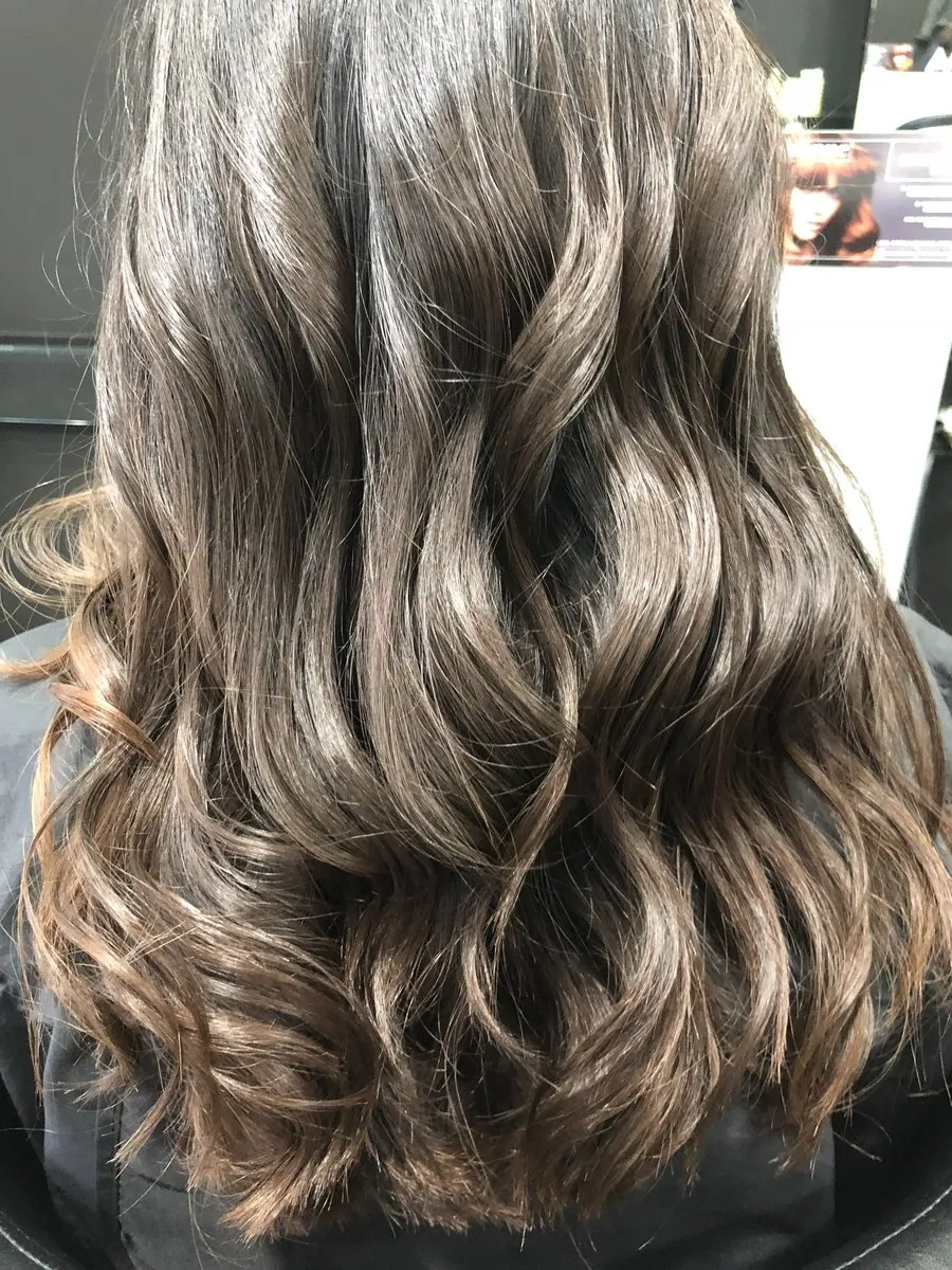 Brunette balayage with wavy texture at DC Hair Lounge