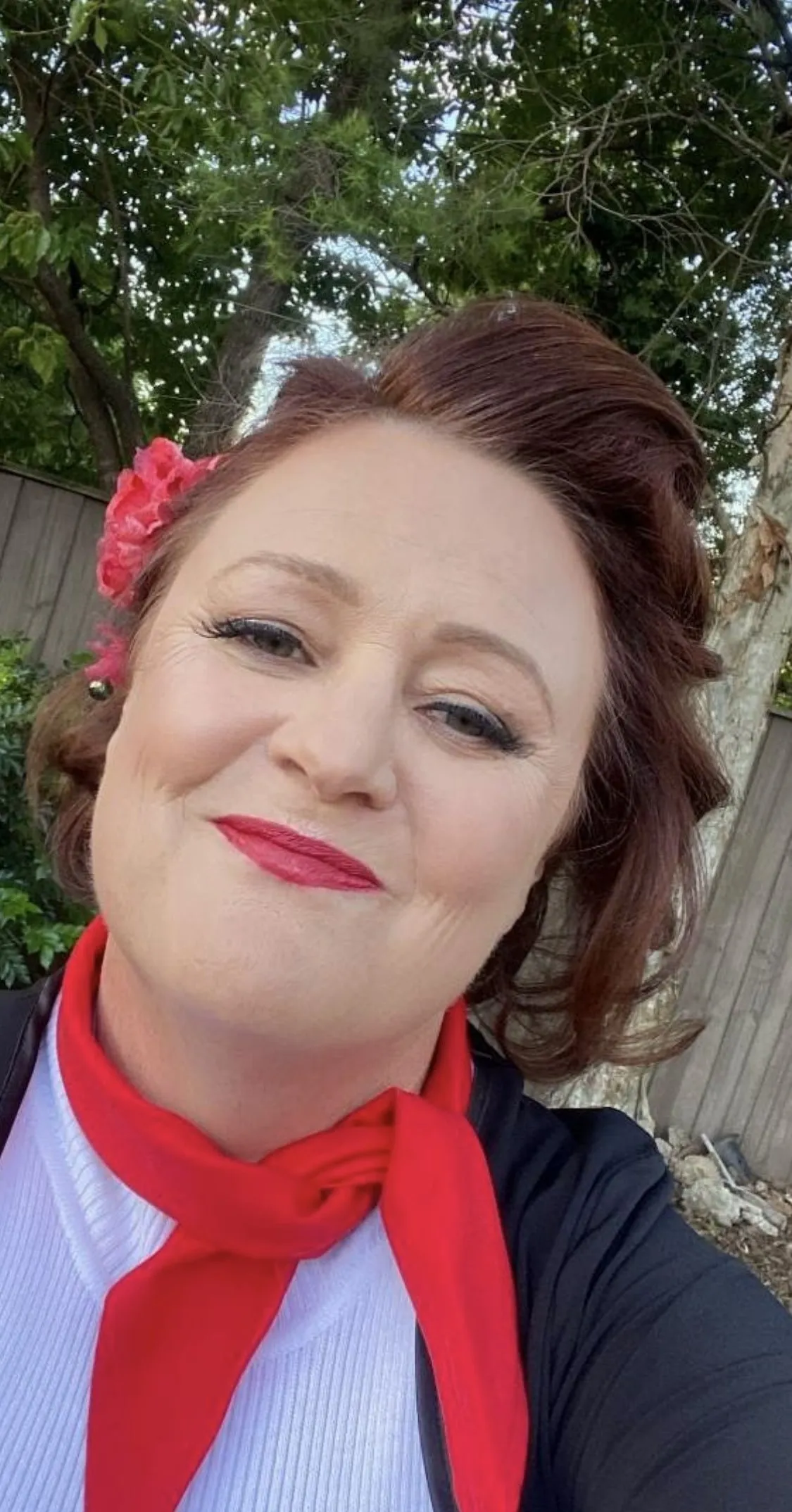 Auburn updo with red flower at DC Hair Lounge Baulkham Hills