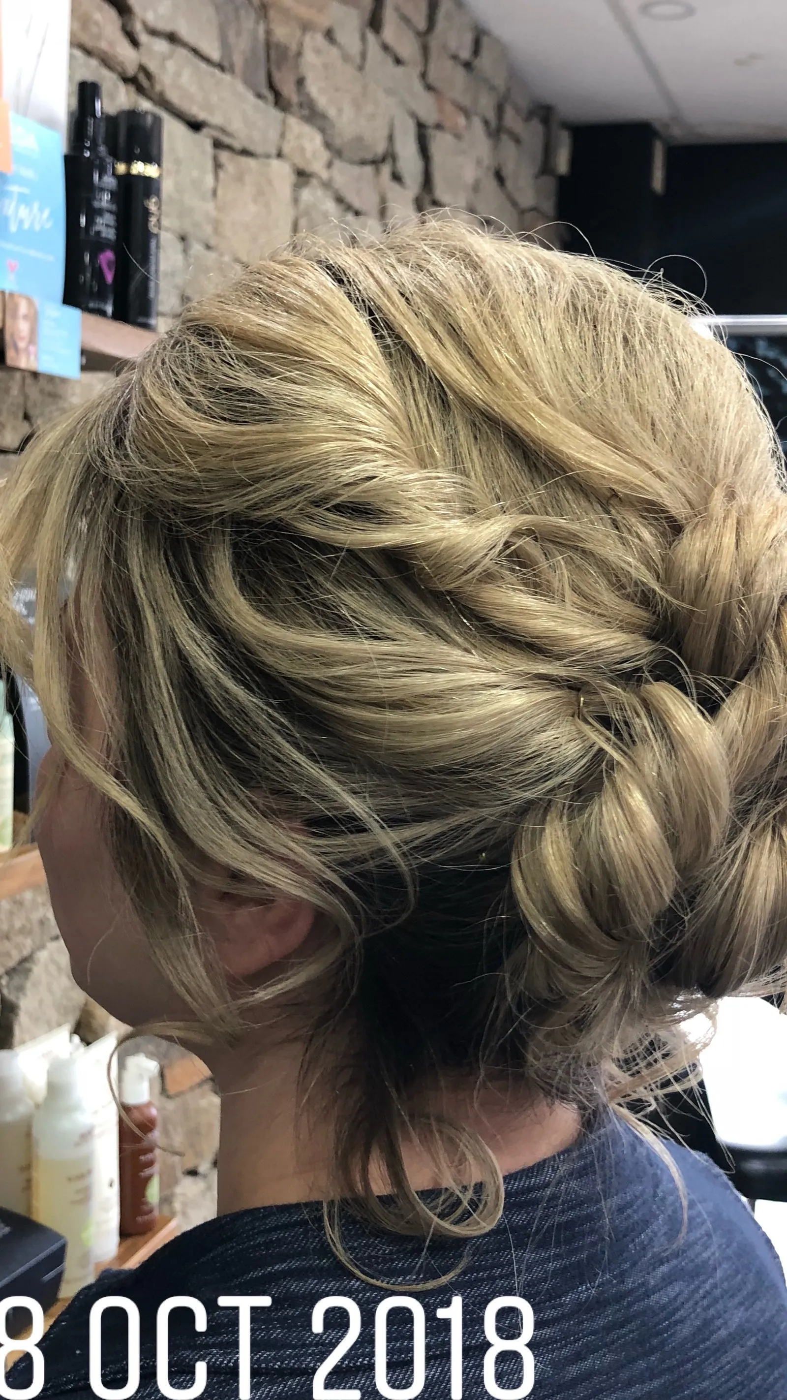 Blonde loose chignon updo at DC Hair Lounge Baulkham Hills