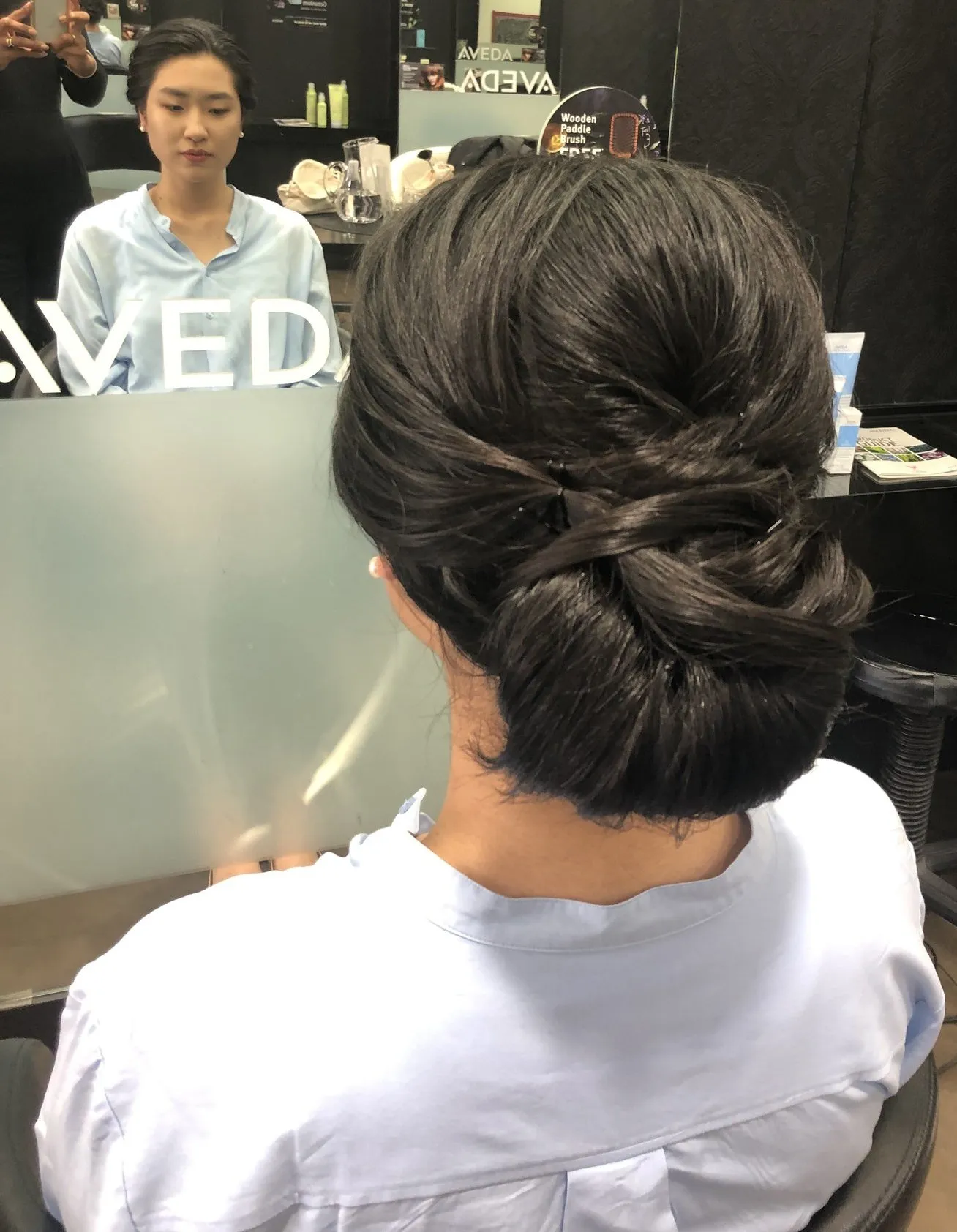 Dark sleek chignon updo at DC Hair Lounge